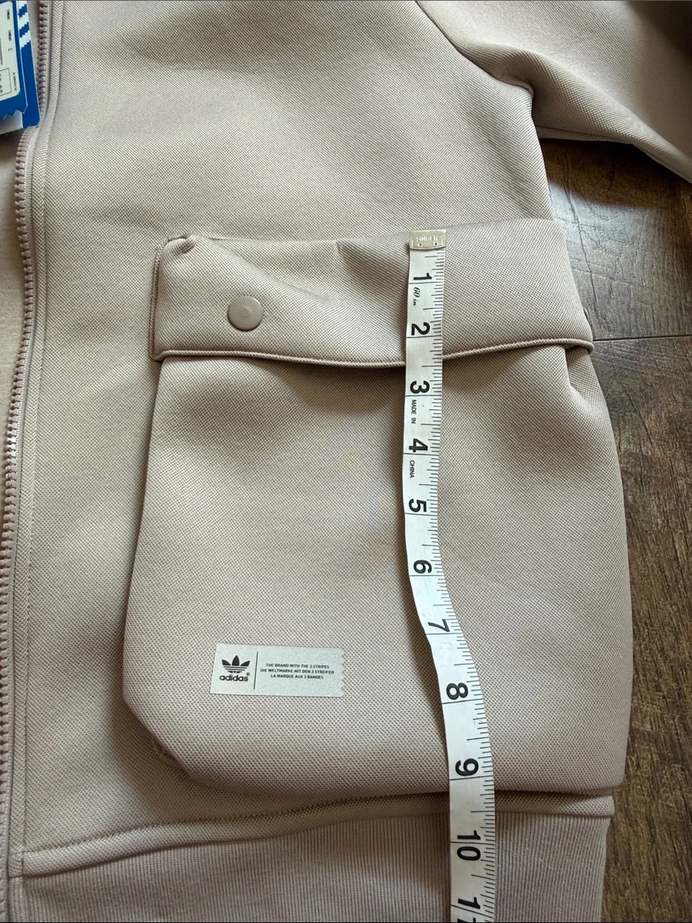 adidas beige bomber jacket with front flap pockets
